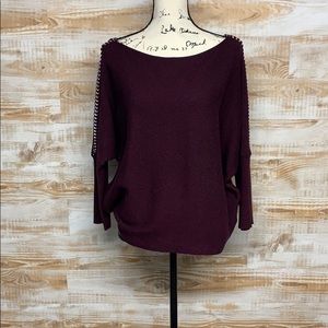 Jennifer Lopez sweater with metal sleeve detail